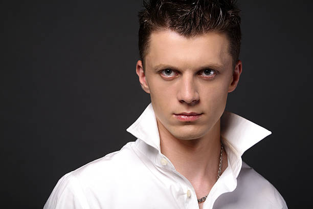 Accessorizing men's attire: Necklace paired with a collared shirt